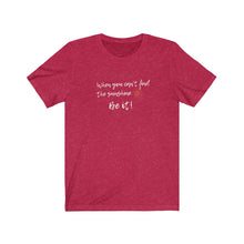 Load image into Gallery viewer, Red Tee Shirt with wording: When you can't find the sunshine, Be it and a sun pic.