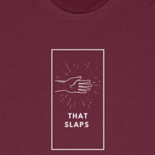 Load image into Gallery viewer, Maroon tee shirt with white box and picture of hand slapping with white wording: That Slaps
