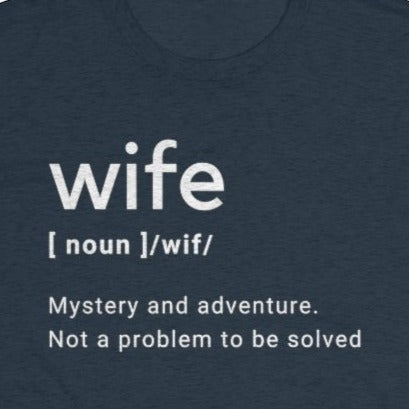Heather Navy Tee Shirt with white wording: Wife (noun) /wif/ Mystery and adventure. Not a Problem to be solved
